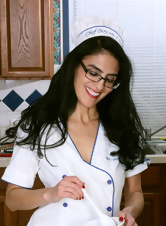 Dark-haired cook takes off white robe to expose her goodies