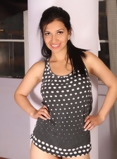 Nice lady takes off polka dot dress to demonstrate hairy pussy