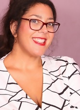 A secretary with a hairy pussy and beautiful glasses very sexy fondles her pussy with a finger