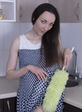 Naked housewife shows her hairy pussy in the kitchen