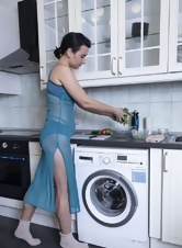 Sexy maid chops salad and shows off her bare hairy pussy in the kitchen 