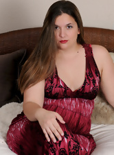 Brunette in red lingerie shows her bare backside just for fun